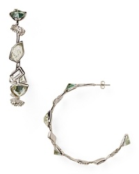 The jagged-edged gems of Alexis Bittar's rhodium hoop earrings evoke the edgy glamor of the designer's New York City muses. Wear your pair to perfect downtown accessorizing. The jagged-edged gems of Alexis Bittar's rhodium hoop earrings evoke the edgy glamor of the designer's New York City muses. Wear your pair to perfect downtown accessorizing.