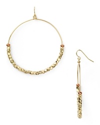 Work this season's exotic influences into your accessories collection with this pair of beaded hoop earrings from Vanessa Mooney, accented by an eclectic mix of golden nuggets. Work this season's exotic influences into your accessories collection with this pair of beaded hoop earrings from Vanessa Mooney, accented by an eclectic mix of golden nuggets.