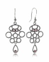 A chandelier silhouette takes on added elegance with sterling silver cables and bezel-set rhodolite stones. Earrings by PANDORA.