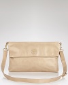 Versatile and polished. Tory Burch's leather messenger bag epitomizes day-right accessorizing, with a convertible shape, neutral hue and sleek look.