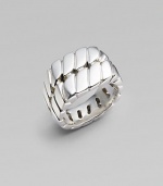 A bold signet style crafted with in gleaming sterling silver with curb chain detail. About ¾ diam. Imported