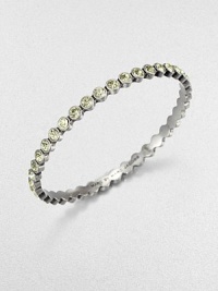 Lovely faceted glass stones with a radiant silvery tint are dotted along a slender bangle with a polished finish.GlassSilvertoneDiameter, about 2.5Imported Lovely faceted glass stones with a radiant silvery tint are dotted along a slender bangle with a polished finish.GlassSilvertoneDiameter, about 2.5Imported