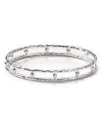 Have fun when you accessorize. Melinda Maria's double row bangle showcases arcade-inspired shine that's all grown up--the silver style wins with all-black. Have fun when you accessorize. Melinda Maria's double row bangle showcases arcade-inspired shine that's all grown up--the silver style wins with all-black.