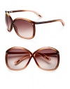 Modern oversized cat eye shaped frames with iconic Tom Ford floating lens and tubular acetate temple. Available in gradient brown/light orange with gradient brown/rose lens.Acetate 100% UV protection Made in Italy 