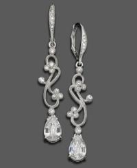 Crystal accents and rhodium-plated mixed metal weave together in an enticing swirl on these Eliot Danori earrings. Approximate drop: 1-1/4 inches. Crystal accents and rhodium-plated mixed metal weave together in an enticing swirl on these Eliot Danori earrings. Approximate drop: 1-1/4 inches.