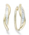 Up your glam factor. YellOra™'s chic twisted hoop earrings showcase baguette-cut diamonds front and center (1/4 ct. t.w.). Precious metal made from a combination of pure gold, sterling silver and palladium. Approximate diameter: 3/4 inch.