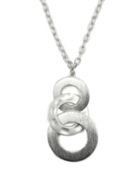 Encircle yourself with standout style. Jones New York necklace features three interlocking circles in polished, silver tone mixed metal. Approximate length: 18 inches. Approximate drop: 2-1/2 inches. Encircle yourself with standout style. Jones New York necklace features three interlocking circles in polished, silver tone mixed metal. Approximate length: 18 inches. Approximate drop: 2-1/2 inches.