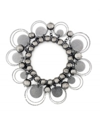 Pretty and practical: Sandblasted paillettes and delicate beads embellish this bracelet from Style&co., while the stretch design gives it a flexible fit. Made in hematite tone mixed metal. Approximate diameter: 2-1/4 inches. Pretty and practical: Sandblasted paillettes and delicate beads embellish this bracelet from Style&co., while the stretch design gives it a flexible fit. Made in hematite tone mixed metal. Approximate diameter: 2-1/4 inches.