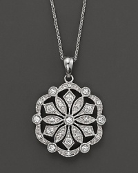 A diamond medallion, set in 14K white gold, makes an unforgettable statement. A diamond medallion, set in 14K white gold, makes an unforgettable statement.