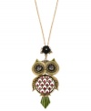All eyes will be on you with this whimsical owl pendant necklace from Betsey Johnson. Crafted from gold-tone mixed metal, the large pendant features glass crystal accents in shades of purple for a colorful touch. Approximate length: 31 inches + 3-inch extender. Approximate drop: 5 inches.