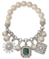 Quite charming. Two styles blend together to stunning effect in this stretch charm bracelet from Carolee. Crafted from silver-tone mixed metal and simulated pearls, the bracelet's eclectic look makes it truly stand out. Approximate length: 7-1/2 inches.