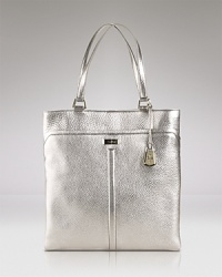 A hardworking wardrobe starts with wear-with-all accessories like this leather tote from Cole Haan. In leather with a spacious silhouette, it's idea for desk or dinner. A hardworking wardrobe starts with wear-with-all accessories like this leather tote from Cole Haan. In leather with a spacious silhouette, it's idea for desk or dinner.