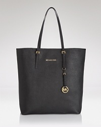 Lend your look a classic accent with this leather tote from MICHAEL Michael Kors. Elegant and understated, this versatile piece is ideal (and sized right) for everyday. Lend your look a classic accent with this leather tote from MICHAEL Michael Kors. Elegant and understated, this versatile piece is ideal (and sized right) for everyday.