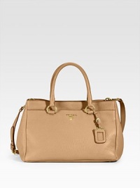 Dramatic, pebbled leather design in a wide shape includes a luggage tag and a detachable crossbody strap for added versatility. Double straps, 5½ drop Adjustable strap, 18-20 drop Snap closure Two exterior snap closure pockets Inside zipper pocket, snap pocket Metal feet Signature jacquard lining 16W X 10H X 7½D Made in Italy Dramatic, pebbled leather design in a wide shape includes a luggage tag and a detachable crossbody strap for added versatility. Double straps, 5½ drop Adjustable strap, 18-20 drop Snap closure Two exterior snap closure pockets Inside zipper pocket, snap pocket Metal feet Signature jacquard lining 16W X 10H X 7½D Made in Italy