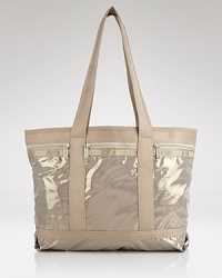 Cooly blending practical design with a fashionable feel, LeSportsac's roomy nylon tote makes a smart travel companion. Cooly blending practical design with a fashionable feel, LeSportsac's roomy nylon tote makes a smart travel companion.