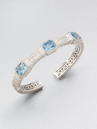 A highly intricate design with three emerald-cut blue topaz stones. Blue topazRhodium-plated sterling silverDiameter, about 2.25Slip-on styleImported A highly intricate design with three emerald-cut blue topaz stones. Blue topazRhodium-plated sterling silverDiameter, about 2.25Slip-on styleImported