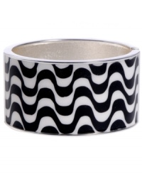 Infuse your look with the wild colors and funky patterns of Brasil. Crafted in silver tone mixed metal Haskell's Streets bangle features black and white wavy stripes and a hinge clasp. Approximate diameter: 2-1/2 inches. Approximate length: 8 inches. Item comes packaged in a turquoise gift box.