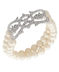Support a worthy cause with style. Carolee's 40th Anniversary Limited Edition stretch bracelet, crafted from silver-tone mixed metal, features two rows of glass pearls for twice the glamour. Approximate length: 7-1/2 inches. Support a worthy cause with style. Carolee's 40th Anniversary Limited Edition stretch bracelet, crafted from silver-tone mixed metal, features two rows of glass pearls for twice the glamour. Approximate length: 7-1/2 inches.