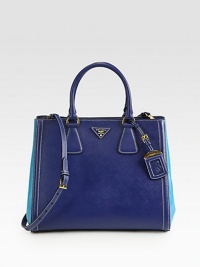 A two-tone style in luxurious saffiano leather.Double top handles, 5½ dropDetachable adjustable shoulder strap, 17-19 dropSnap button closureProtective metal feetTwo inside zip pocketsThree inside open pocketsLogo lining13W X 11H X 6¼DMade in Italy A two-tone style in luxurious saffiano leather.Double top handles, 5½ dropDetachable adjustable shoulder strap, 17-19 dropSnap button closureProtective metal feetTwo inside zip pocketsThree inside open pocketsLogo lining13W X 11H X 6¼DMade in Italy