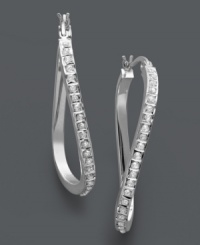 A simple twist and a lot of shine. These unique hoop earrings feature a twisted design accented by dozens of sparkling diamonds. Set in sterling silver. Approximate drop length: 1-1/2 inches. Approximate drop width: 1 inch. A simple twist and a lot of shine. These unique hoop earrings feature a twisted design accented by dozens of sparkling diamonds. Set in sterling silver. Approximate drop length: 1-1/2 inches. Approximate drop width: 1 inch.