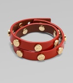 An edgy patent leather design with goldtone hardware.Patent leatherPost closureAbout 16 longImported