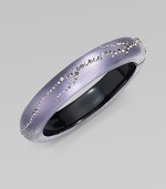 From the Lucite Lavender Dust Collection. A subtly textured, narrow bangle in soft wisteria, crafted of hand-sculpted, hand-painted Lucite, sprinkled with shimmering Swarovski crystals.LuciteCrystalDiameter, about 2¼Width, about ½Hinged with magnetic claspMade in USA