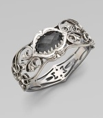 From the Silver Les Dents De La Mer Collection. A lovely grey cat's eye and quartz crystal set in a beautifully intricate, black and white plated sterling silver shark's jaw. Grey cat's eye and quartz crystalBlack and white rhodium plated sterling silverDiameter, about 2¼Box clasp closureImported 