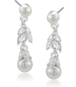 Feminine and fanciful. Add a ladylike look to your style with Carolee's floral linear drop earrings. Featuring luminous glass pearls and glittering glass accents, they're set in silver tone mixed metal. Approximate drop: 1-3/8 inches.