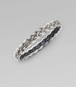 From the Woven Cable Collection. An elegant braid of sterling silver weaves textured and smooth strands into a sophisticated bangle. Sterling silver Diameter, about 2¼ Width, about ¼ Imported