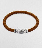 From the Weave Collection. Woven rubber is accented with an intricately engraved silver clasp.Sterling silver Rubber Width, about 5.5mm Length, about 7 Chevron clasp closure Imported