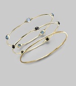 Five faceted blue topaz stones are sprinkled along a slender bangle of 18k gold. Blue topaz 18k yellow gold Diameter, about 2¾ Imported Please note: Bracelets sold separately.