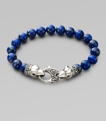 A welcome touch of color, strung with 10mm lapis beads and a raven's head sterling silver clasp. About 9¼ long Imported