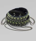 An edgy, street-smart design with oxidized links brightly stitched onto a double-wrap leather cuff with draped chains and a bold stud closure.LeatherGoldtoneCotton backingLength, about 16½Width, about 3Stud snap closureImported