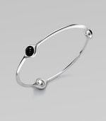 A sleek and modern piece with three smooth black agate stations set in sterling silver. Black agateSterling silverSlip-on styleLength, about 7¾Imported 