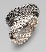 Fabulously crafted bangle of blackened sterling silver displays a sculptural stud pattern with one contrasting stud at the clasp. Sterling silver Diameter, about 2½ Width, about ¾ Hinged with clasp Imported Please note: Bracelets sold separately.