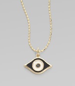 This protective evil eye, strung from a 14k yellow gold chain, is richly punctuated by a black diamond. Diamond, 0.2 tcw Enamel 14k yellow gold Chain length, about 16 Pendant width, about ½ Claw clasp Made in USA 