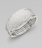 EXCLUSIVELY AT SAKS. Open strands of pavé crystal flow into a dazzling oval medallion of pure sparkle.Crystal Rhodium plated Diameter, about 2¼ Hinged with push-lock clasp Imported