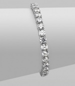 EXCLUSIVELY AT SAKS. Clear cubic zirconia stones in a classic tennis bracelet design.Cubic zirconia Rhodium plated sterling silver Length, about 7 Push lock closure Imported 