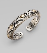 From the Naga Collection. A stunning hinged cuff, both graceful and bold, combines sterling silver and 18k yellow gold with graphic, textural richness. 18k yellow gold and sterling silver Diameter, about 2½ Width, about ½ Hinged Made in Bali