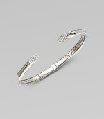 A slim cuff accented with white sapphires adorned ends. White sapphires Sterling silver Kick mechanism closure Diameter, about 2¼ Imported 