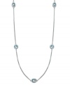 Long and luxurious. This pretty strand necklace features round and oval-cut stations of blue topaz (12 ct. t.w.) on a delicate sterling silver chain. Approximate length: 36 inches.
