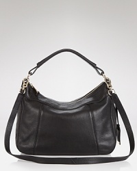 Cole Haan gives it's signature hobo a cool update. Crafted from leather and perfectly proportioned for busy days, it's a bold example of practical style. Cole Haan gives it's signature hobo a cool update. Crafted from leather and perfectly proportioned for busy days, it's a bold example of practical style.