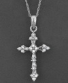 Bask in the glorious beauty of this cross pendant featuring round-cut diamonds (1/6 ct. t.w.) set in 14k white gold. Approximate length: 18 inches. Approximate drop: 1-1/2 inches.