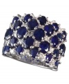 A true blue beauty! EFFY Collection's bold and beautiful cocktail ring highlights dozens of oval-cut sapphires (7-1/6 ct. t.w.) and sparkling round-cut diamonds (5/8 ct. t.w.). Band set in 14k white gold. Approximate width: 7/8 inch.