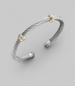 From the Thoroughbred Collection. A signature Yurman sterling silver cable, richly adorned with two textured bands of 14k gold. Sterling silver & 14k yellow gold Cable, 5mm Diameter, about 2¼ Made in USA