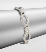 A graceful design featuring links in various shapes accented in pavé crystals. CrystalsRhodium-plated brassLength, about 7.5Box and tongue closureImported 