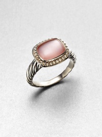 From the Noblesse Collection. A pretty pink mother-of-pearl cabochon center surrounded by a diamond accented border set in sterling silver cable shank. Pink mother-of-pearlDiamonds, .21 tcwSterling silverWidth, about .39Imported 