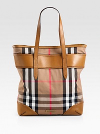 Iconic house check print denim accented with luxurious leather in a classic shape.Double leather shoulder straps, 8 dropMagnetic snap strap closureOne inside zip pocketTwo inside open pocketsFully lined13W X 15H X 3½DMade in Italy Iconic house check print denim accented with luxurious leather in a classic shape.Double leather shoulder straps, 8 dropMagnetic snap strap closureOne inside zip pocketTwo inside open pocketsFully lined13W X 15H X 3½DMade in Italy