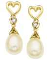 The look of love. A heart-shaped design, along with cultured freshwater pearls (6-8 mm) and diamond accents, helps make these earrings a pair to embrace. Crafted from 10k gold. Approximate drop: 3/4 inch.