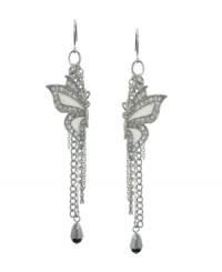 Create a lofty look in breezy butterflies by GUESS. Earrings feature Mother of Pearl and crystal-accented wings. Silver tone mixed metal chain drops and crystal teardrops complete the look. Approximate drop: 2 inches. Create a lofty look in breezy butterflies by GUESS. Earrings feature Mother of Pearl and crystal-accented wings. Silver tone mixed metal chain drops and crystal teardrops complete the look. Approximate drop: 2 inches.